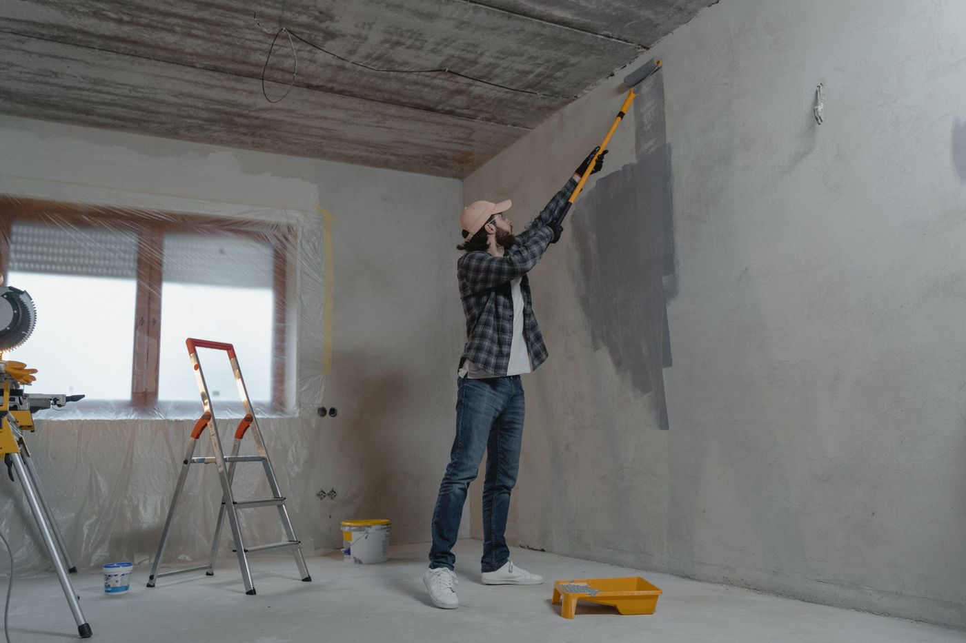 Licensed stock photograph of interior wall painting in progress